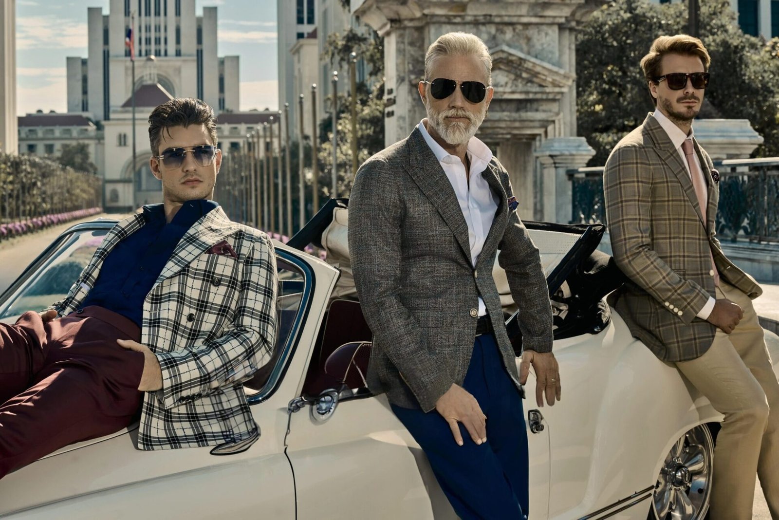 Patterned sport coats styled beside a classic car